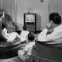 family_watching_tv_in_livingroom_50s.jpg